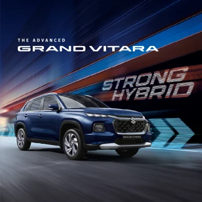 Maruti Suzuki Grand Vitara Strong Hybrid SUV exterior in Arctic White. View on-road price and offers for the top model with Panoramic Sunroof in Palghar and Navi Mumbai.